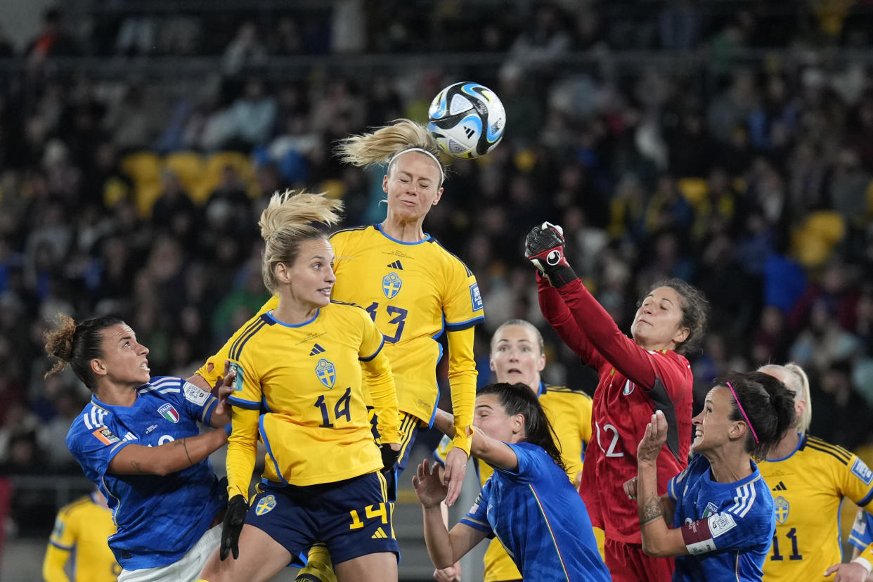 Sweden's Amanda Ilestedt, center, heads the ball to score the opening goal during the Women's World Cup Group G soccer match between the Sweden and Italy in Wellington, New Zealand, Saturday, July 29, 2023. (AP Photo/John Cowpland)