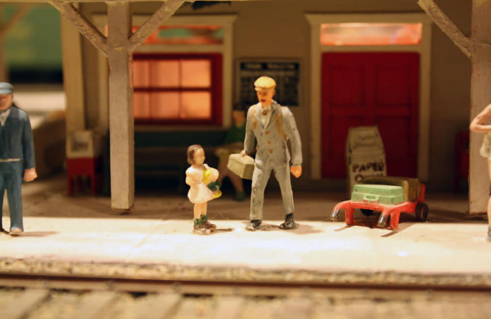 A father waits with his daughter for a train. After 67 years in the Liberty Village location, The Model Railroad Club of Toronto will be moving to make way for a condo.