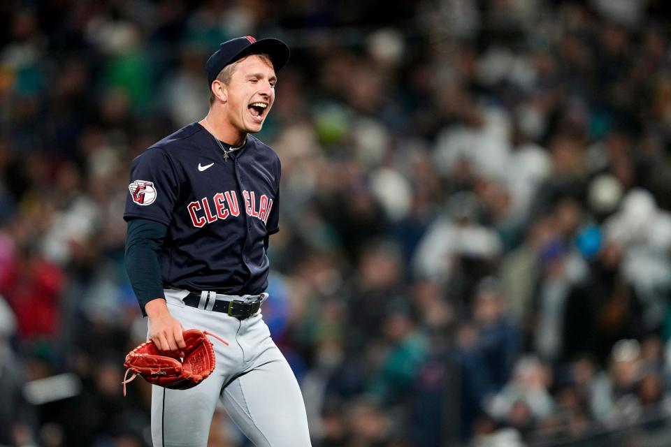 Cleveland Guardians relief pitcher James Karinchak reacts after striking out Seattle Mariners'  Julio Rodriguez with two runners on base to end the eighth inning Saturday, April 1, 2023, in Seattle.