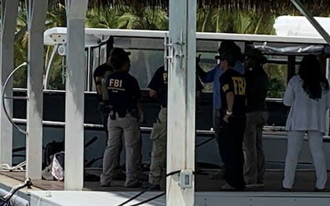 FBI agents are seen at Little St. James Island, one of the properties of late financier Jeffrey Epstein - Credit: Reuters