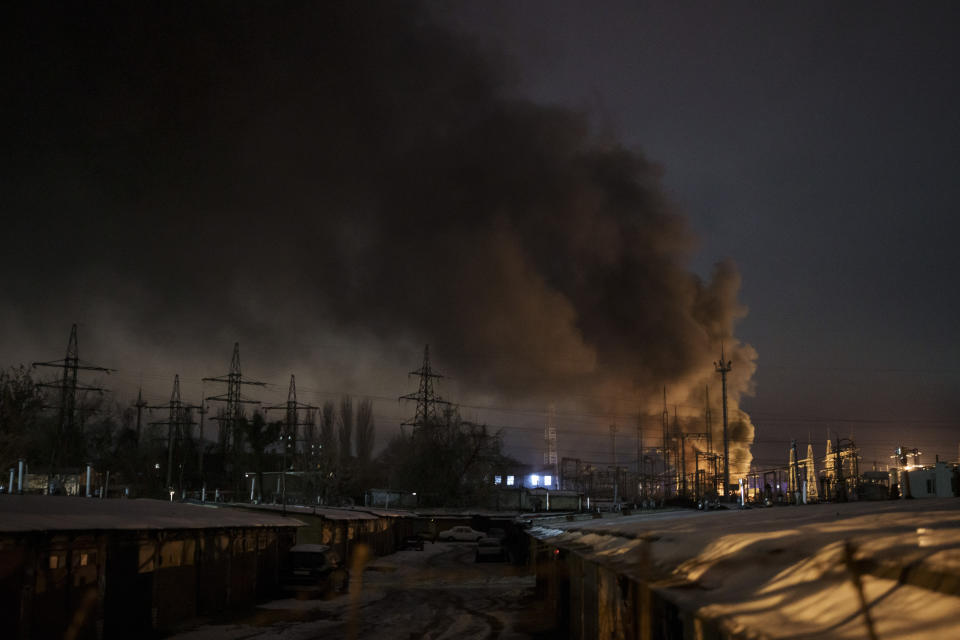 FILE - Smoke billows from a power infrastructure following a Russian drone attack in Kyiv region, Ukraine, Monday, Dec. 19, 2022. Russia's repeated attacks on Ukraine's energy infrastructure have left millions of civilians in the cold and the dark as temperatures plummet. (AP Photo/Felipe Dana, File)