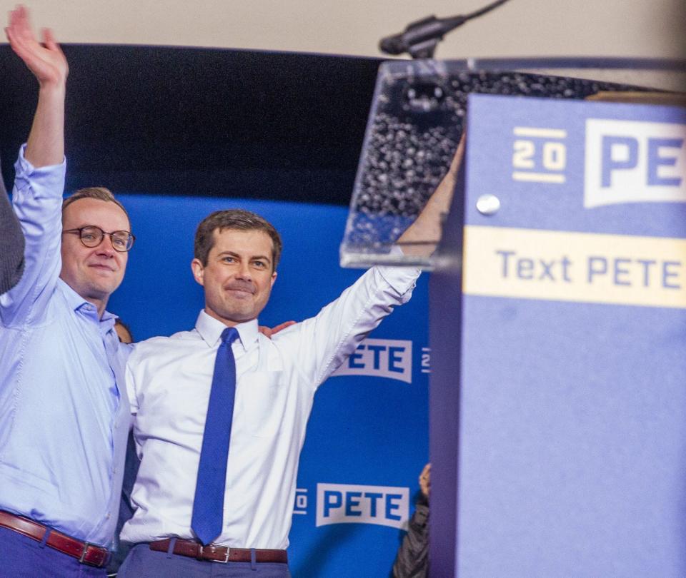 Pete Buttigieg and his husband, Chasten, stand on stage in a former Studebaker plant building on April 14, 2019, after Pete announced he was running for president.