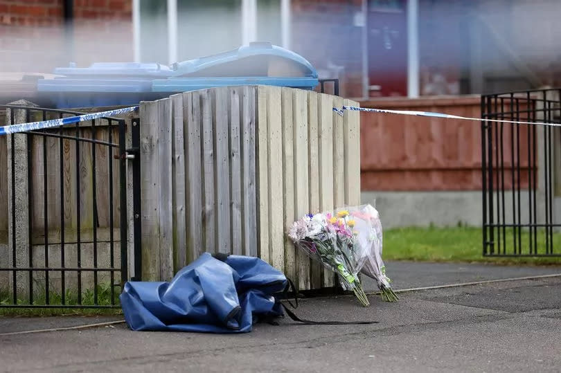 Flowers left at the scene in Barnard Road, Gorton