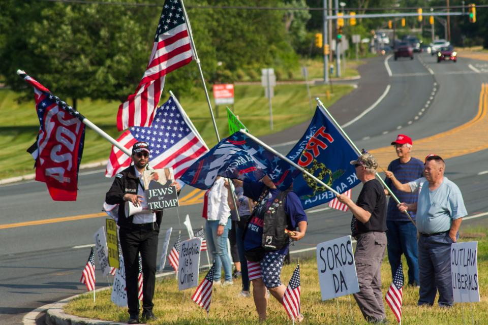 Protesters gathered outside of Clarence Dillion Public Library in Bedminster, N.J to oppose the indictment of former president Donald Trump.