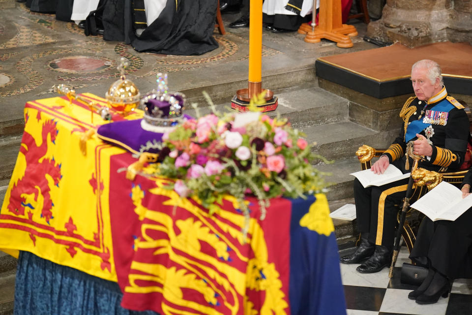 <p>King Charles III in front of the Queen's coffin during her state funeral at Westminster Abbey in London.</p> 