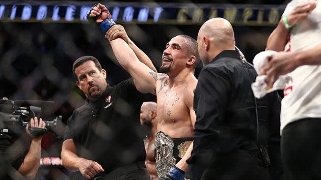 Whittaker with his UFC title. Pic: Getty