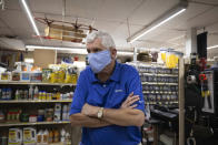 Fred Byrnside, owner of Byrnside Hardware, speaks with an Associated Press reporter in his store in Danville, W.Va., on Tuesday, Oct. 13, 2020. Business has fallen off in the store he has run for 30 years. Since 2014, West Virginia has lost nearly a third of its remaining full-time coal jobs as production declines. “There was a time when 24-year-olds were getting jobs here in the mines,” Byrnside said. (AP Photo/Chris Jackson)