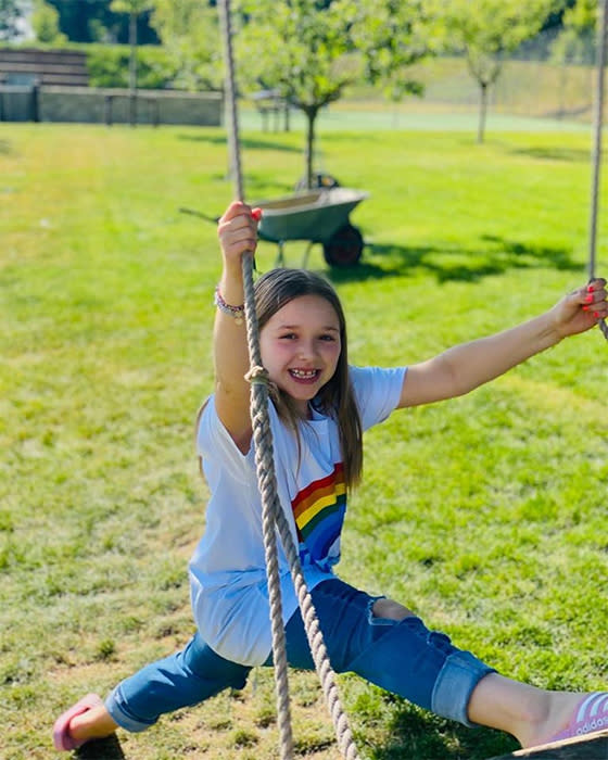 Harper-Beckham-garden-swing