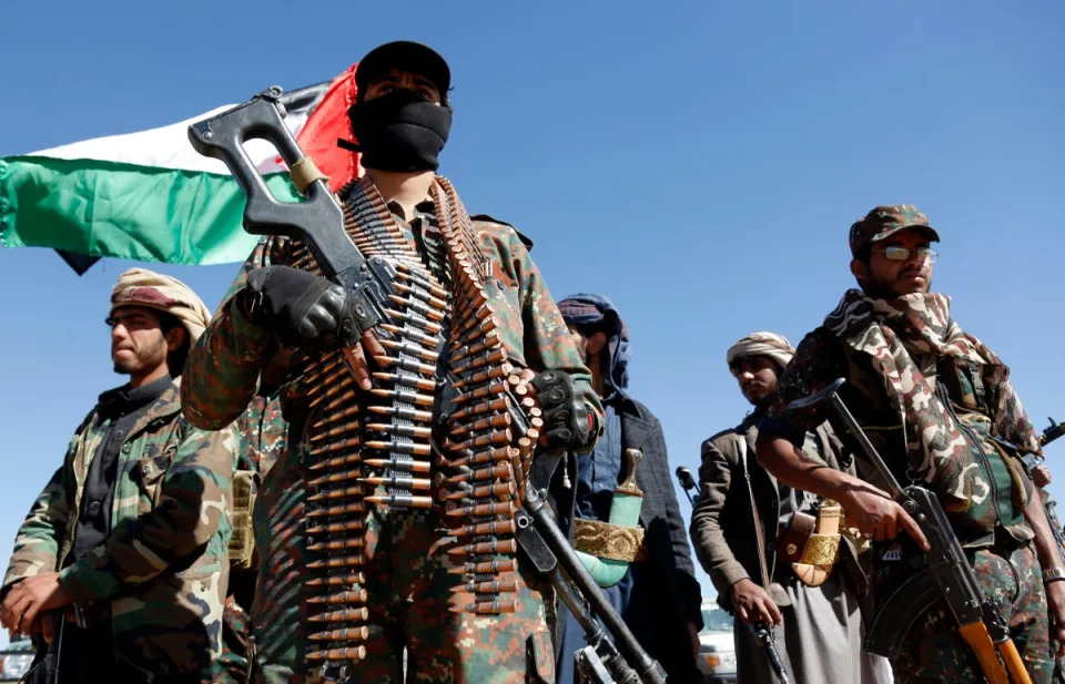 Houthi fighters and tribesmen stage a rally against the US and the UK strikes on Houthi-run military sites near Sanaa, Yemen (AP)