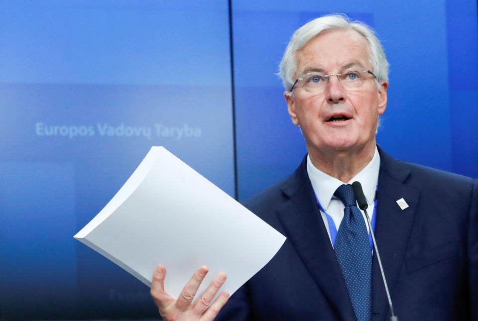 EU chief negotiator Michel Barnier holding a copy of the 585 page withdrawal agreement (Reuters)