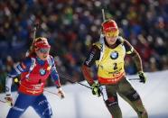 Biathlon - IBU World Championships - Women 12.5 km Mass Start - Hochfilzen, Austria - 19/2/17 - Laura Dahlmeier of Germany and Gabriela Koukalova of Czech Republic in action. REUTERS/Leonhard Foeger