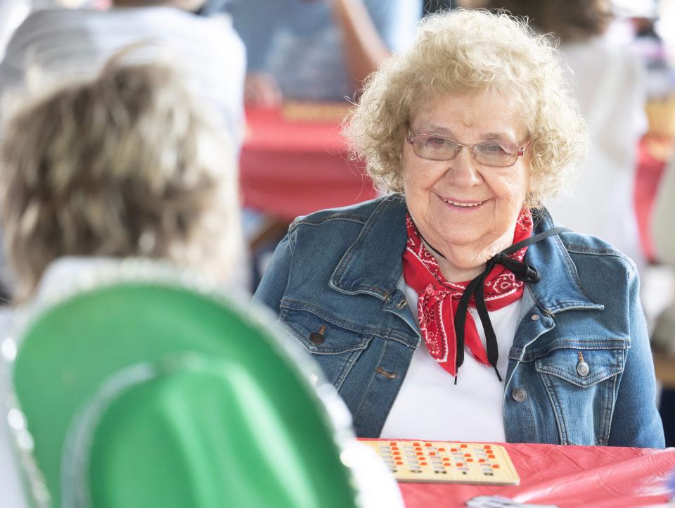 Sharon Harris enjoys a game of bingo with friends at the Massillon Senior Center's western-themed barbecue.