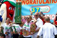 <p>Miki Sudo celebrates her victory in the 2018 Nathan’s Famous International Hot Dog Eating Contest at Coney Island in the Brooklyn borough of New York City, United States on July 4, 2018. (Photo: Atilgan Ozdil/Anadolu Agency/Getty Images) </p>