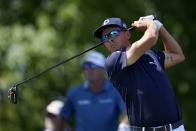 Rickie Fowler watches his tee shot on the 11th hole during the second round of the 3M Open golf tournament at the Tournament Players Club in Blaine, Minn., Friday, July 22, 2022. (AP Photo/Abbie Parr)