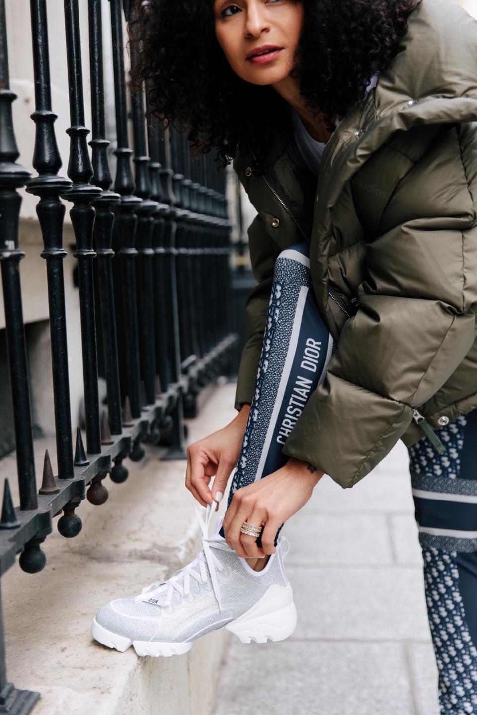 De Silva in a pair of Dior leggings with silver laminated knit D-Connect sneaker. - Credit: Allie Provost