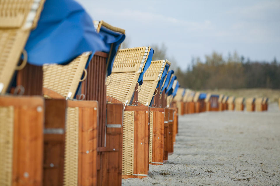 Row of beach chairs on a sandy beach