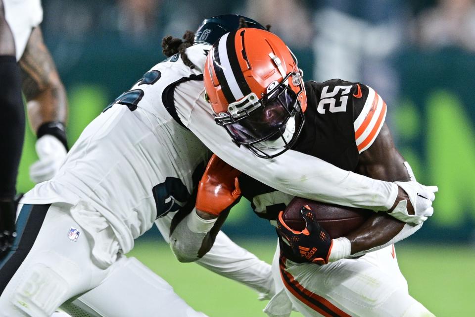 Cleveland Browns running back Demetric Felton Jr. (25) is tackled by Philadelphia Eagles safety Terrell Edmunds (26) during the first half of an NFL preseason football game Thursday, Aug. 17, 2023, in Philadelphia. (AP Photo/Derik Hamilton)