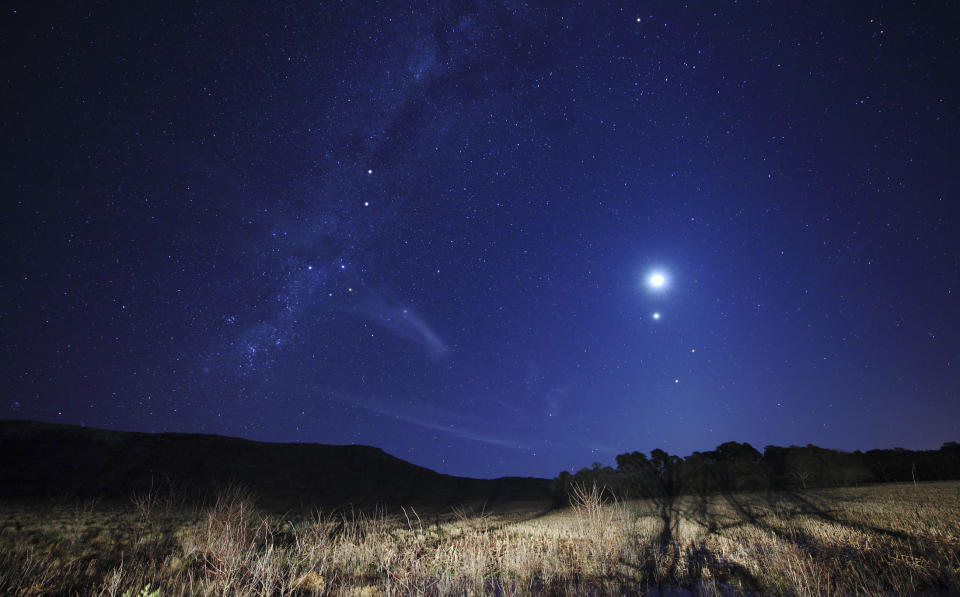 three bright dots stand out in the night sky