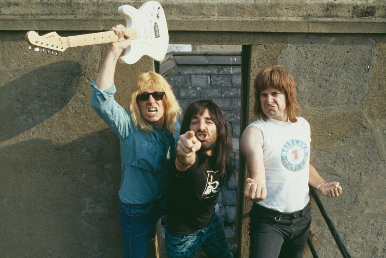 Spinal Tap (L-R; Michael McKean (David St. Hubbins), Harry Shearer (Derek Smalls), and Christopher Guest (Nigel Tufnel)), 1984