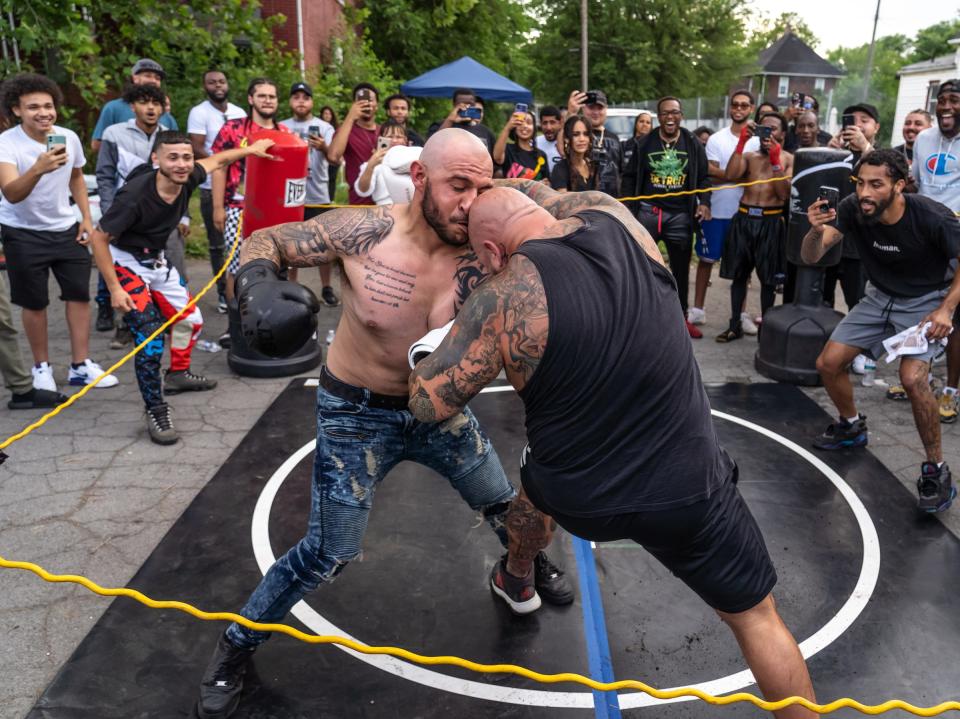 Jose Barba, left, of Detroit, and Ryan Rays, of Westland, exchange punches while fighting during a Pick Your Poison Detroit event in Detroit's Delray neighborhood on Sunday, June 19, 2021. "It's not about win or lose it's all about respect. Don't expect to win. Go for it," said Barba. "That's how you win come out and get your ass kicked."