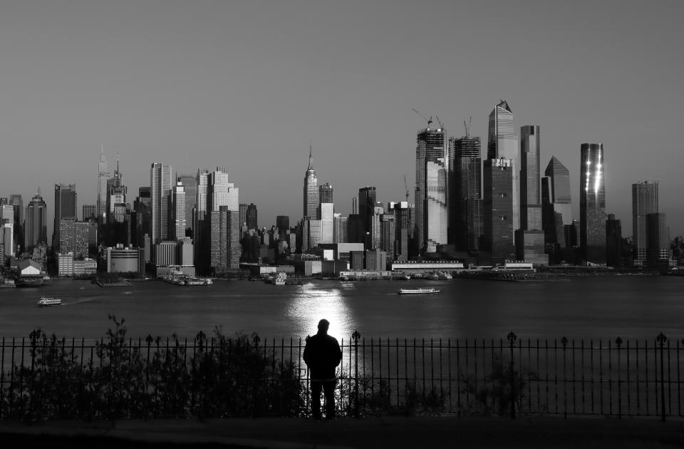 The sun sets on the skyline of midtown Manhattan on April 23 as seen from Weehawken, New Jersey.<span class="copyright">Gary Hershorn—Getty Images</span>