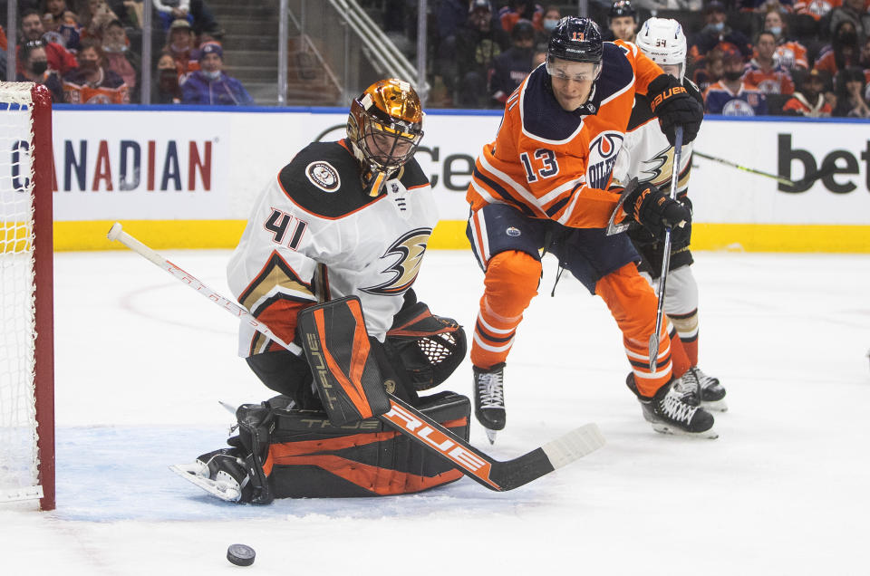 Anaheim Ducks goalie Anthony Stolarz (41) makes a save on Edmonton Oilers' Jesse Puljujarvi (13) during the second period of an NHL hockey game Tuesday, Oct. 19, 2021, in Edmonton, Alberta. (Jason Franson/The Canadian Press via AP)