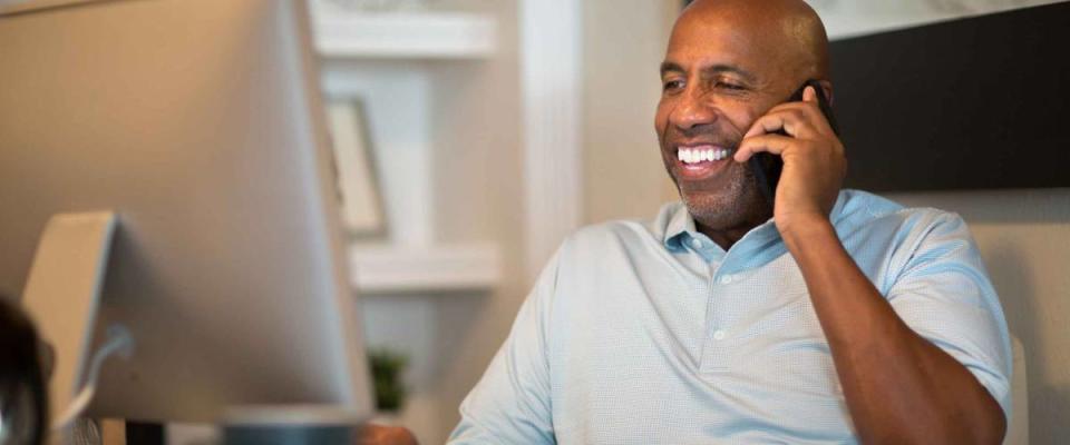 African American man working from his home office.