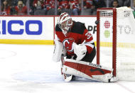 A shot by Carolina Hurricanes left wing Josh Leivo (not shown) gets by New Jersey Devils goaltender Jon Gillies (32) for a goal during the second period of an NHL hockey game, Saturday, Jan. 22, 2022, in Newark, N.J. (AP Photo/Noah K. Murray)