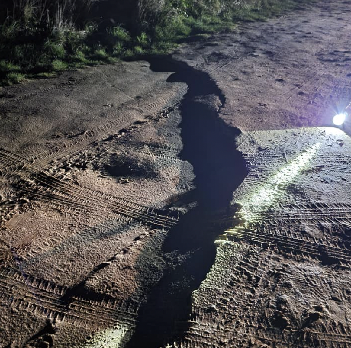 Coastguards released dramatic pictures of the large crack in the road, urging people to avoid the area. (HM Coastguard Bacton)