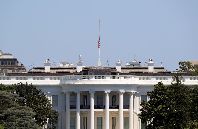 American flag is lowered to half-staff following the death of Congressman John Lewis (D-GA), on the White House in Washington