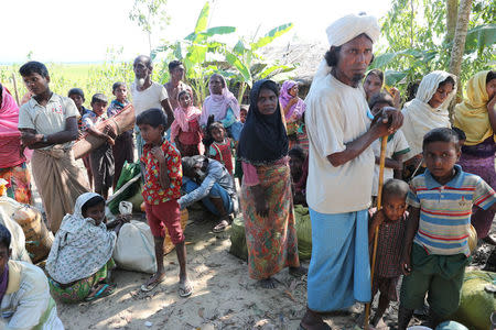 Rohingya refugees wait for vehicles to reach a refugee camp in Bangladesh November 19, 2017. REUTERS/Mohammad Ponir Hossain