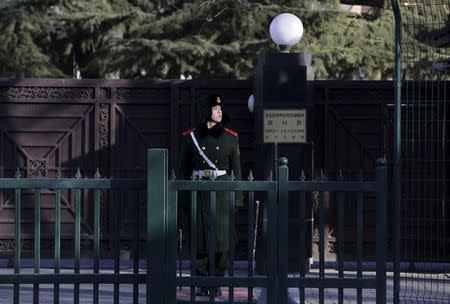 A paramilitary policeman stands guard in front of the North Korean embassy in Beijing, China, February 7, 2016. REUTERS/Jason Lee