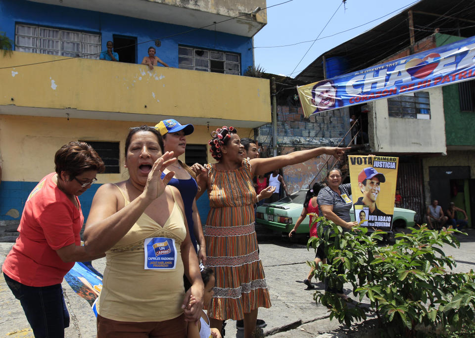 Supporters of opposition presidential candidate Henrique Capriles cheer during a campaign rally in Caracas, Venezuela, Sunday, Sept. 16, 2012. Capriles is running against President Hugo Chavez in the country's Oct. 7 election. (AP Photo/Fernando Llano)