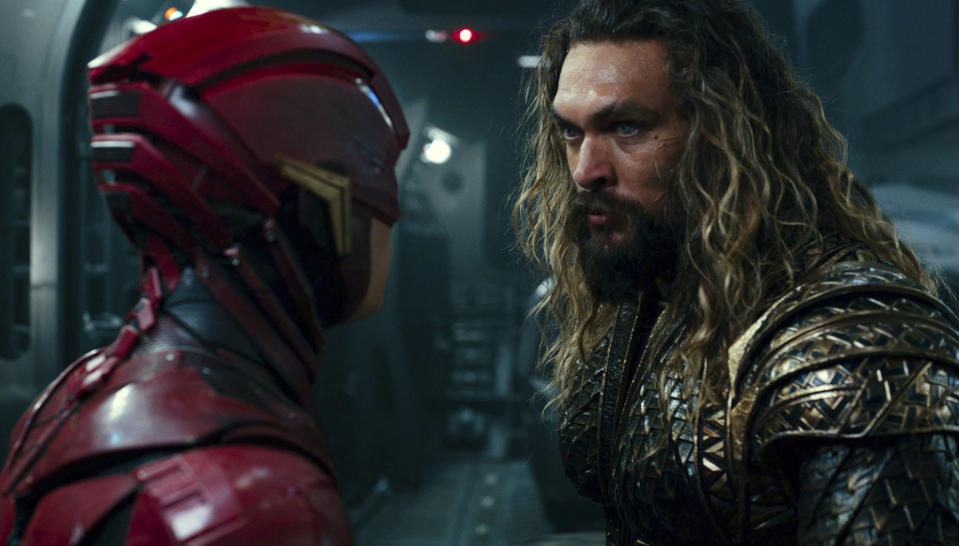 This image released by Warner Bros. Pictures shows Ezra Miller, left, and Jason Momoa in a scene from “Justice League.” (Warner Bros. Entertainment Inc. via AP)