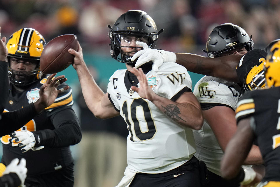 Wake Forest quarterback Sam Hartman (10) gets his pass knocked down by Missouri defensive lineman Jayden Jernigan during the first half of the Gasparilla Bowl NCAA college football game Friday, Dec. 23, 2022, in Tampa, Fla. (AP Photo/Chris O'Meara)