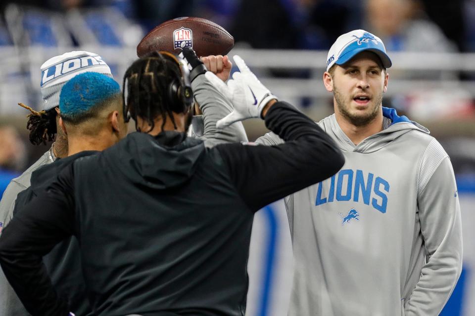 Lions quarterback Jared Goff huddle with wide receivers before the NFC divisional playoff game between the Lions and Buccaneers at Ford Field on Sunday, Jan, 21, 2024.