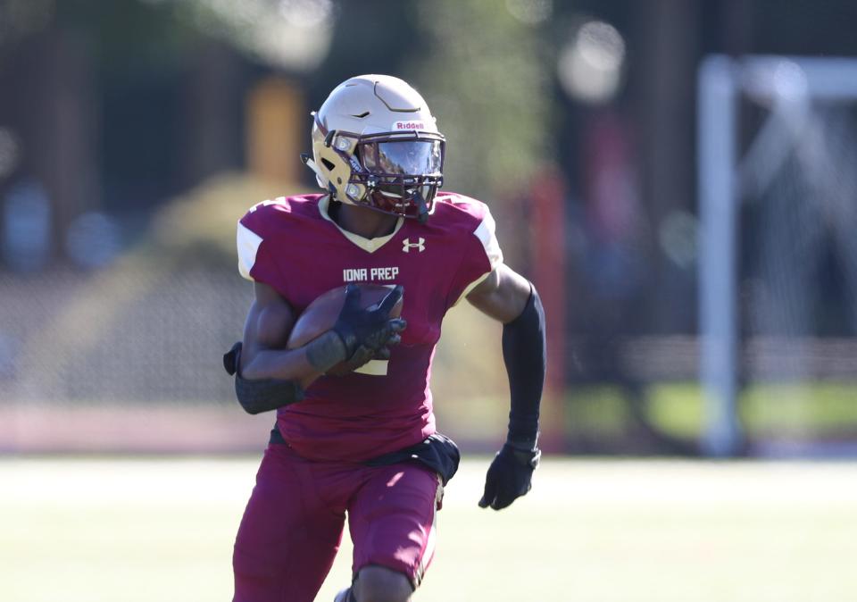 Iona Prep's Ellis Robinson IV (2) runs an interception back for a touchdown during football action against Christ the King at Iona Prep High School, on Saturday, September 25, 2021. 