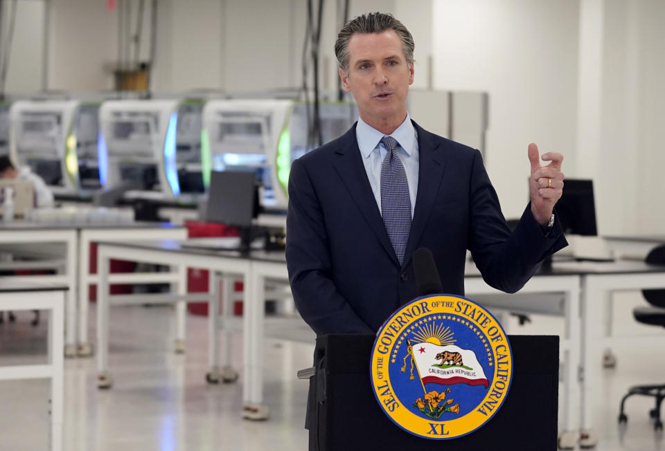 FILE - In this Oct. 30, 2020, file photo, California Gov. Gavin Newsom speaks at a COVID-19 testing facility in Valencia, Calif. Newsom and his family are quarantining after three of his children were exposed to someone who tested positive for the coronavirus, his office said late Sunday, Nov. 22, 2020. (AP Photo/Marcio Jose Sanchez, Pool, File)