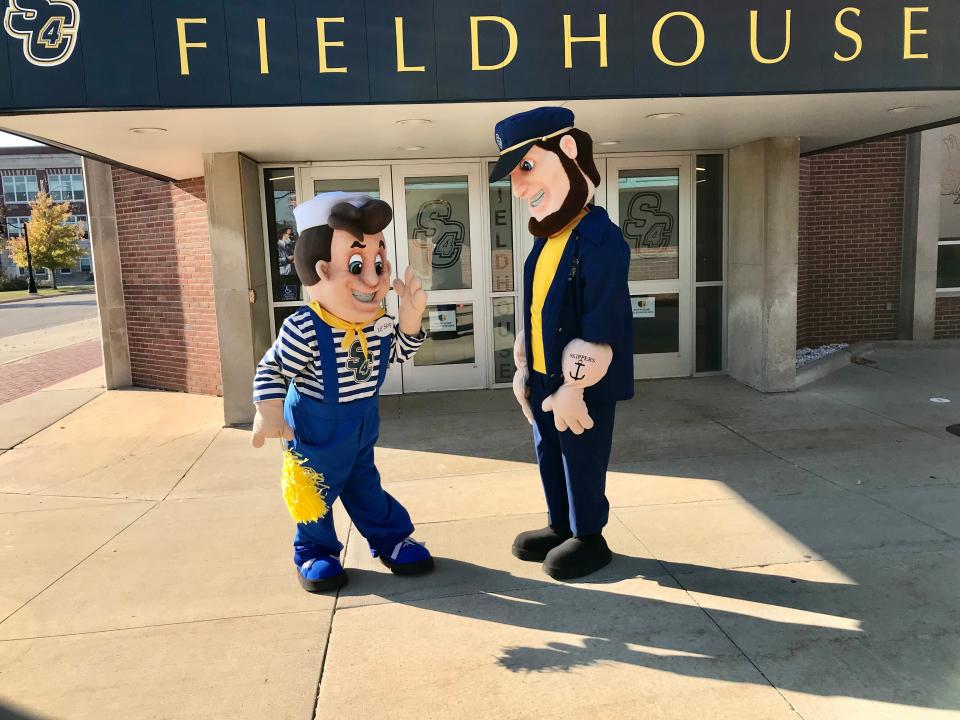 St. Clair County Community College mascot Lil' Skip dances while fellow mascot Skip watches outside SC4 Fieldhouse in Port Huron on Nov. 8, 2021.