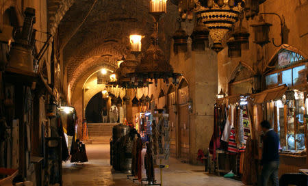 People walk inside the Khan al-Shounah market, in the Old City of Aleppo, Syria December 11, 2009. REUTERS/Khalil Ashawi