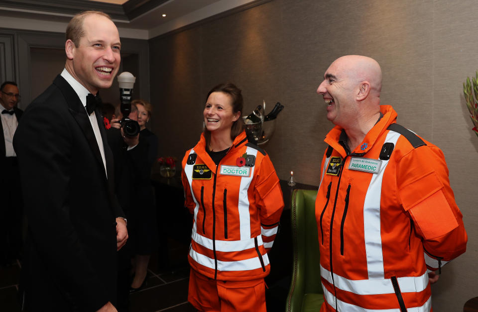 LONDON, ENGLAND - NOVEMBER 07: Prince William, Duke of Cambridge shares a joke with (L-R) Doctor Flora Bird, Consultant in emergency medicine at the Royal London Hospital and Paramedic Steve Jones about how clean their uniforms are, as he attends the London's Air Ambulance Charity gala at Rosewood London on November 07, 2019 in London, England. Prince William is Patron of London's Air Ambulance Charity's 30th Anniversary Campaign. (Photo by Chris Jackson - WPA Pool/Getty Images)