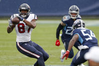 Houston Texans tight end Darren Fells (87) catches a pass as Tennessee Titans inside linebacker Rashaan Evans (54) closes in during the first half of an NFL football game Sunday, Oct. 18, 2020, in Nashville, Tenn. (AP Photo/Wade Payne)