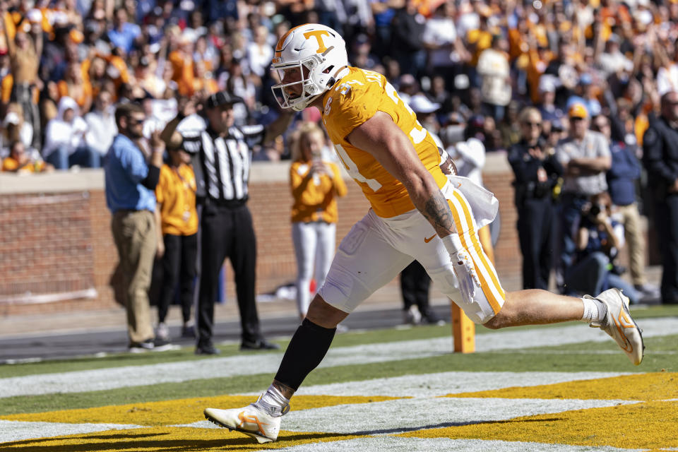 Tennessee tight end McCallan Castles (34) scores a touchdown during the second half of an NCAA college football game against UConn, Saturday, Nov. 4, 2023, in Knoxville, Tenn. (AP Photo/Wade Payne)