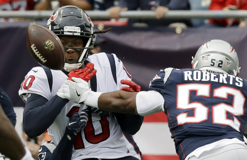 <p>New England Patriots linebacker Elandon Roberts (52) breaks up a pass intended for Houston Texans wide receiver DeAndre Hopkins (10) during the first half of an NFL football game, Sunday, Sept. 9, 2018, in Foxborough, Mass. (AP Photo/Charles Krupa) </p>