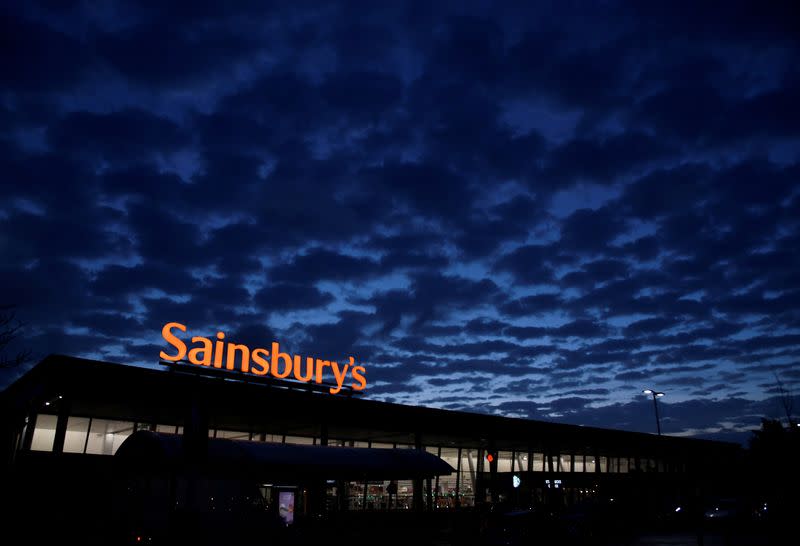 FILE PHOTO: Signage for Sainsbury's is seen at a branch of the supermarket in London