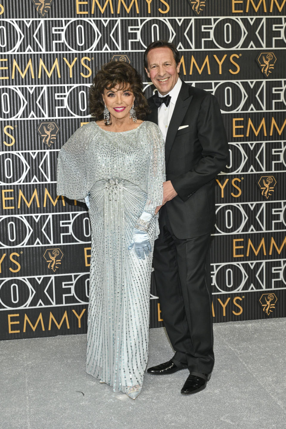 Joan Collins and Percy Gibson at the 75th Primetime Emmy Awards held at the Peacock Theater on January 15, 2024 in Los Angeles, California. (Photo by Michael Buckner/Variety via Getty Images)