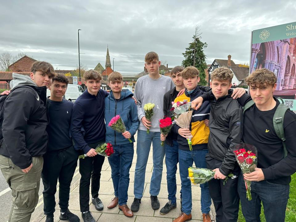 Dan Cox (fourth from left), 16, is among the students at Shrewsbury College bringing flowers in tribute to the four teenagers (The Independent)