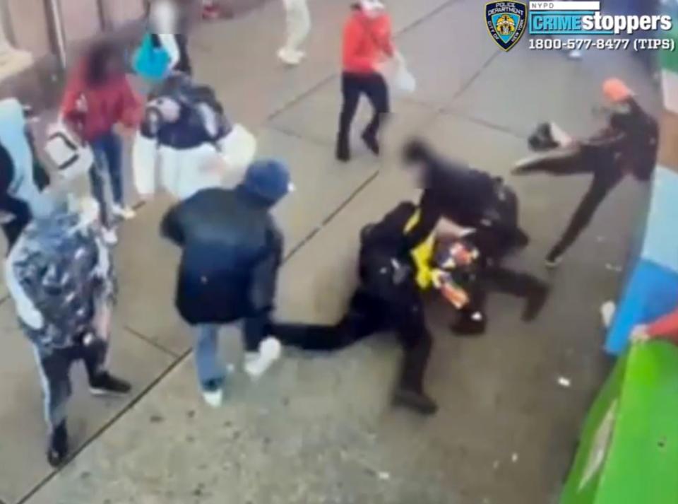 Shocking video captured the moment a migrant mob pounded a pair of cops near Times Square. DCPI