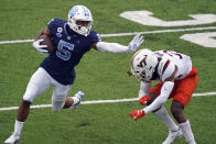 North Carolina wide receiver Dazz Newsome (5) finds some running room against Virginia Tech defensive back Jermaine Waller during the first half of an NCAA college football game in Chapel Hill, N.C., Saturday, Oct. 10, 2020. (AP Photo/Gerry Broome)