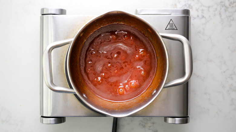 bbq sauce simmering in saucepan